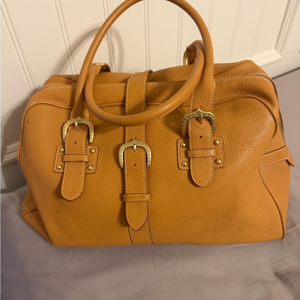 Dooney and Bourke travel bag or great to carry on a plane as a larger purse